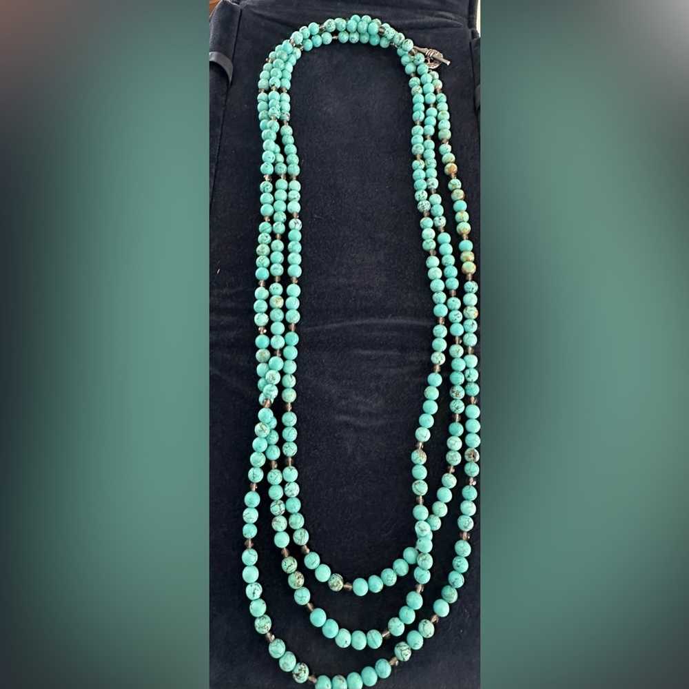 Turquoise beaded necklace with brown glass beads.